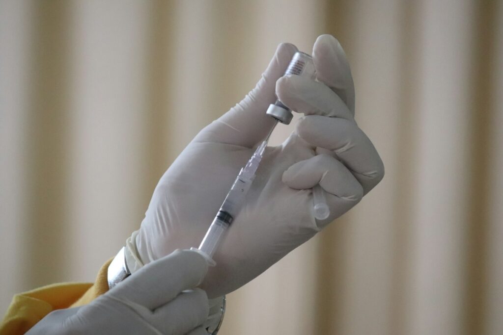 Healthcare worker administering a vaccination